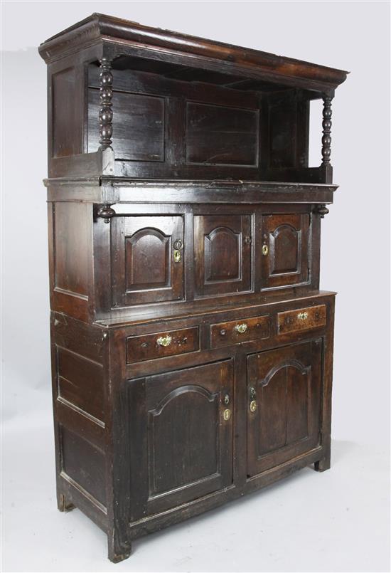 An 18th century oak tridarn, W. 4ft 4in. D. 1ft 9in. H. 6ft 4in.